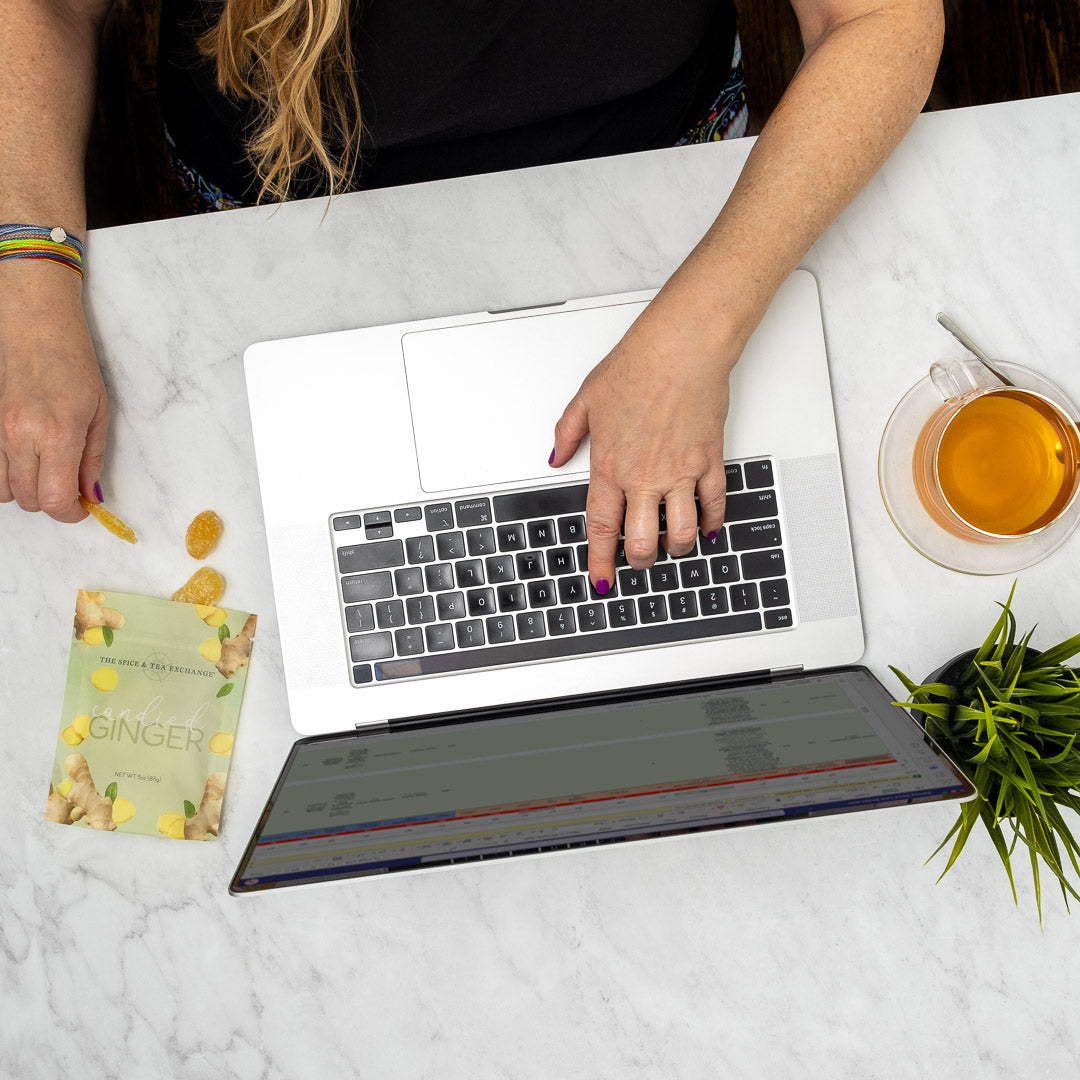 Candied Ginger - bag next to someone working on a laptop