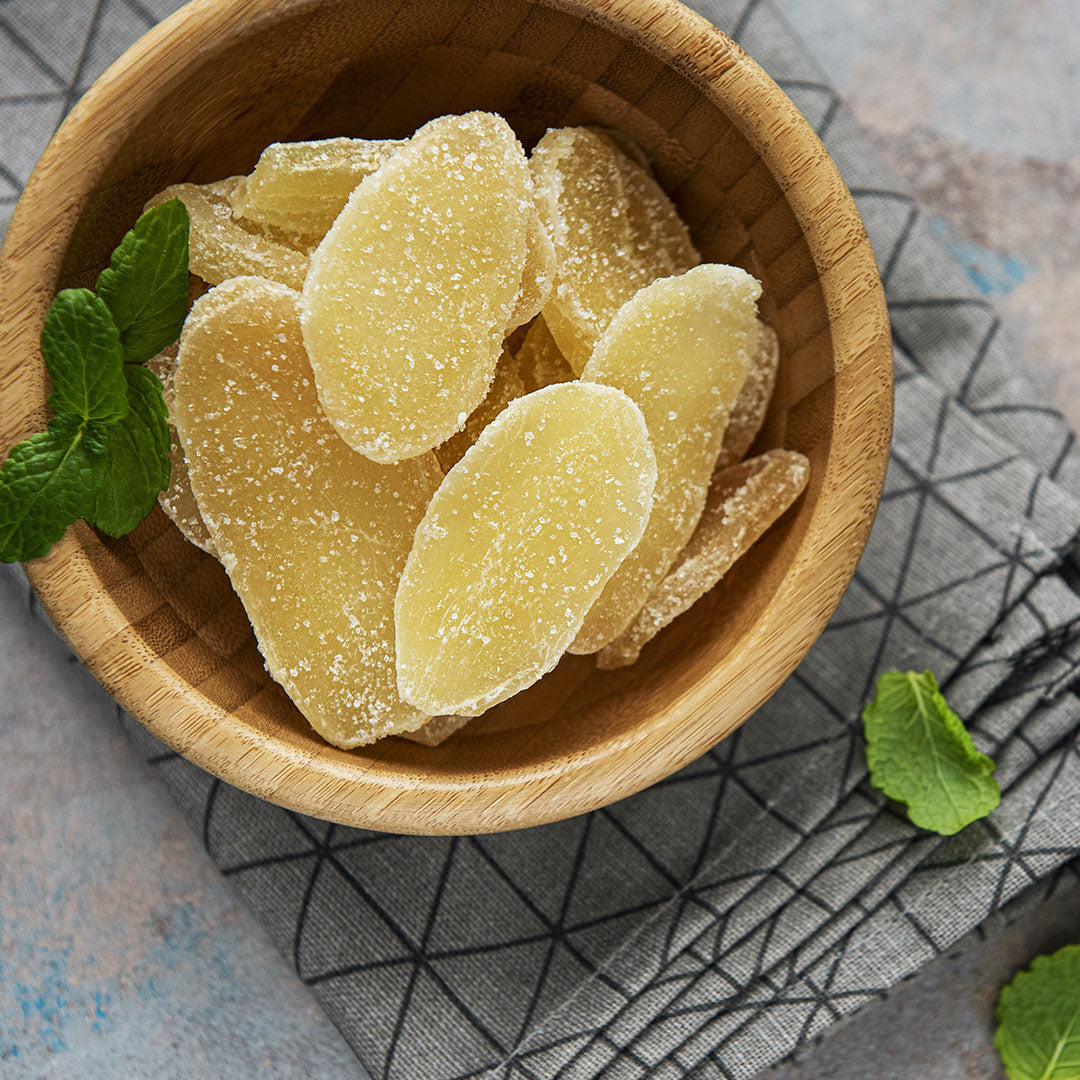 Candied Ginger - in a brown bowl on a grey napkin
