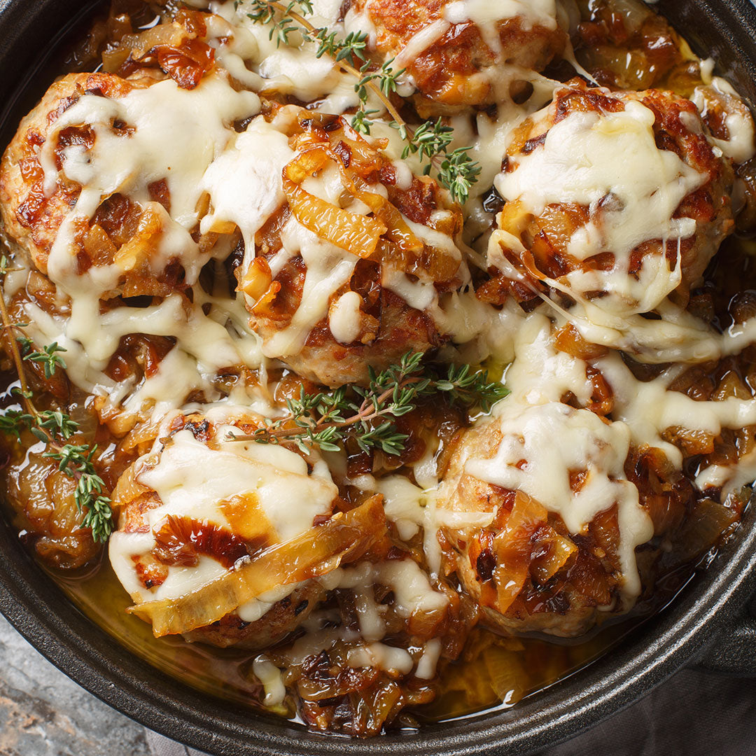 Baked chicken with cheese and herbs in a dish