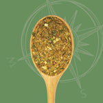 Tuscany Spice Blend in spoon on green background in front of compass logo